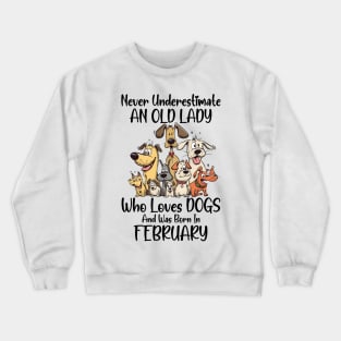 Never Underestimate An Old Lady Who Loves Dogs And Was Born In February Crewneck Sweatshirt